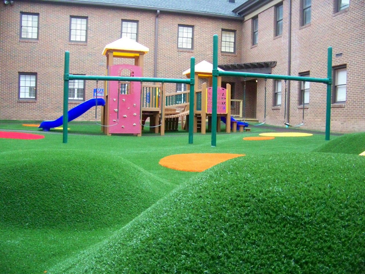 Hilly artificial turf playground by Southwest Greens of Asheville